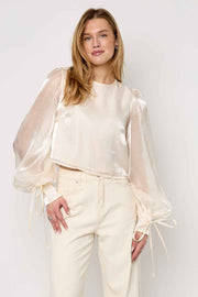 Glanzende parelblouse